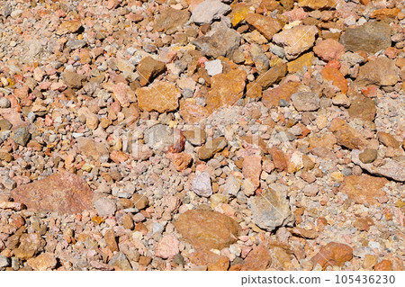 Red stones and earth. The texture of the earth. Red stones and earth. The texture of the earth. 105436230