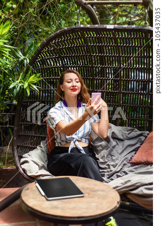 Young beautiful woman looking at pocket mirror prepearing herself for job interview Young beautiful woman looking at pocket mirror prepearing herself for job interview 105437035