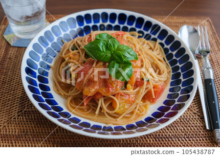 Fresh tomato pasta with basil leaves Fresh tomato pasta with basil leaves 105438787