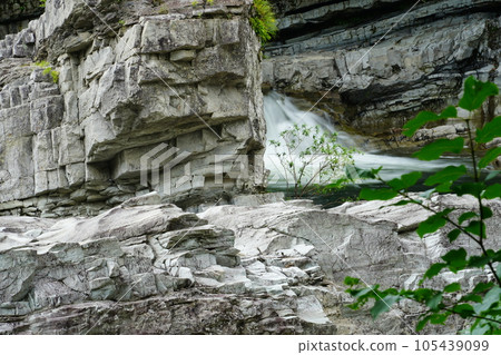The sharp rock face of Ashibetsu Sandan Falls The sharp rock face of Ashibetsu Sandan Falls 105439099