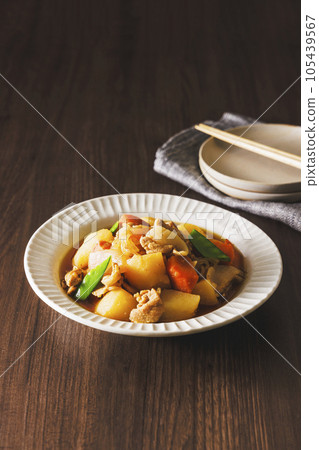 Delicious meat and potatoes served in a white bowl Delicious meat and potatoes served in a white bowl 105439567