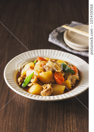 Delicious meat and potatoes served in a white bowl Delicious meat and potatoes served in a white bowl 105439568