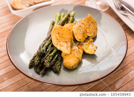 Dietary meal rich in protein. Stir fried chicken breast and green asparagus Dietary meal rich in protein. Stir fried chicken breast and green asparagus 105439943