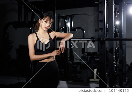 A young woman training at the gym A young woman training at the gym 105440123