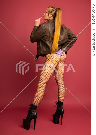 Dancing for adults. Image of sexy pole dancer with lollipop Dancing for adults. Image of sexy pole dancer with lollipop 105440579