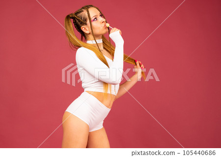 Sexy woman face. Sweet bite. Young Beautiful model with lollipop. Sexy woman face. Sweet bite. Young Beautiful model with lollipop. 105440686
