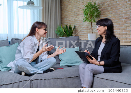 Middle-aged woman at meeting with psychologist, counselor 105440823