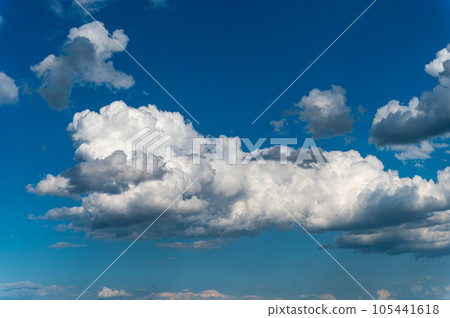 Cumulus clouds in the shape of animals in a blue sky. Cumulus clouds in the shape of animals in a blue sky. 105441618