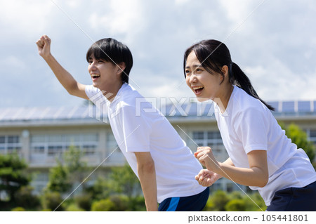 Students cheering in gym clothes Students cheering in gym clothes 105441801