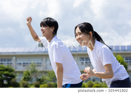 Students cheering in gym clothes Students cheering in gym clothes 105441802