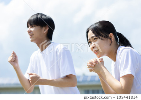 Students cheering in gym clothes Students cheering in gym clothes 105441814