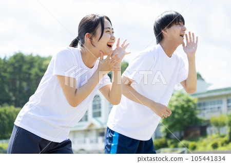 Students cheering in gym clothes 105441834