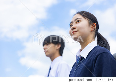 High school boy and girl looking up at the sky 105442163