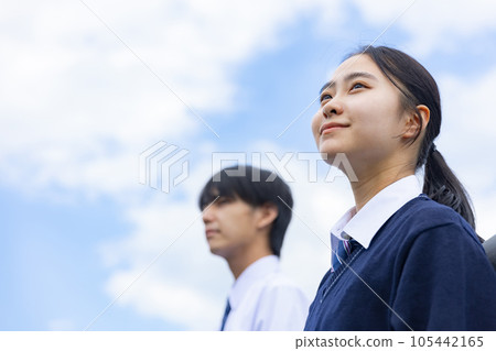 High school boy and girl looking up at the sky High school boy and girl looking up at the sky 105442165