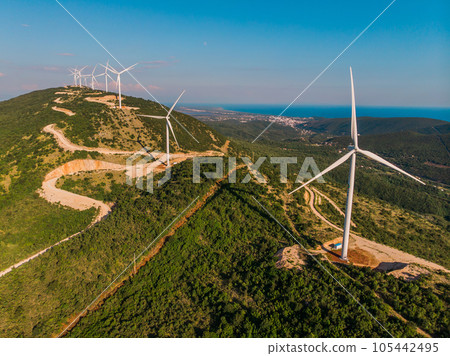 Wind power stations. Renewable energy and clean energy. Wind power is the use of air flow through wind turbines to mechanically power generators for electric power. Wind power stations. Renewable energy and clean energy. Wind power is the use of air flow through wind turbines to mechanically power generators for electric power. 105442495