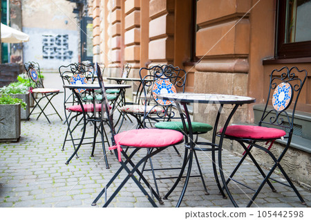 Chairs and table on empty terrace at cafe . Chairs and table on empty terrace at cafe . 105442598