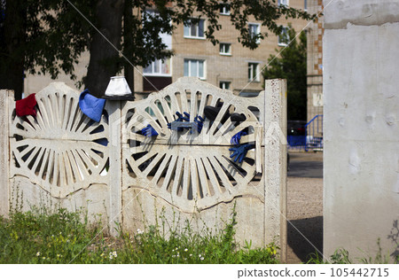 Machine maintenance station, gloves drying in the fence. City of Sterlitamak, Russia, South Ural Machine maintenance station, gloves drying in the fence. City of Sterlitamak, Russia, South Ural 105442715