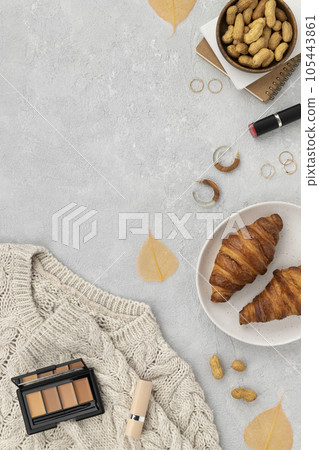 Flat lay top view womens autumn clothes on gray background 105443861