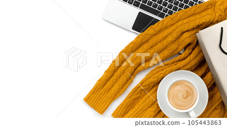 Flat lay top view womens clothes with laptop on white background Flat lay top view womens clothes with laptop on white background 105443863