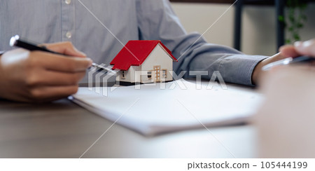Real Estate Agent explain insurance and agreement contract to client before sign contract purchase house Real Estate Agent explain insurance and agreement contract to client before sign contract purchase house 105444199