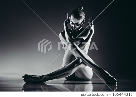 Young woman sitting 105444315