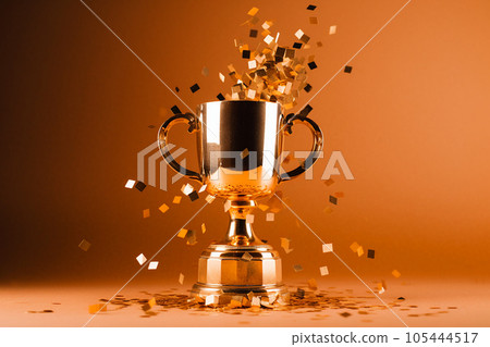 Gold winner cup with confetti. Golden champion cup, trophy for the winner, award, victory, first place of competition, winning and success concept. Copy space. Ai generated 105444517