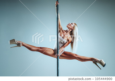 Woman pole dancing 105444900