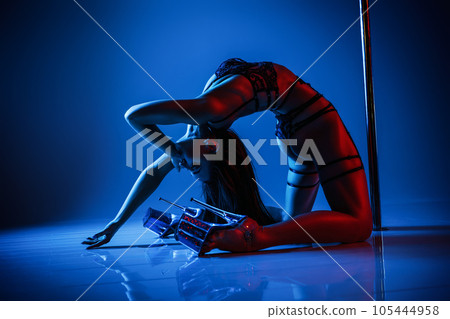 Woman pole dancing Woman pole dancing 105444958