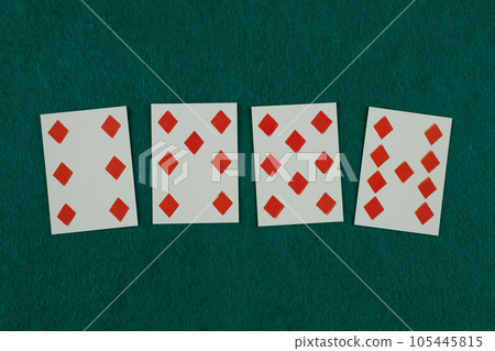 Old west era playing card on gambling table. 105445815