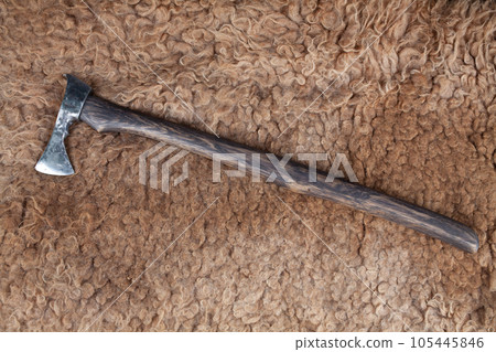 Battle axe on sheep fur 105445846