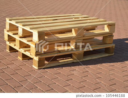 Wooden pallets are placed on the track in pairs to be used as benches. Wooden pallets are placed on the track in pairs to be used as benches. 105446188