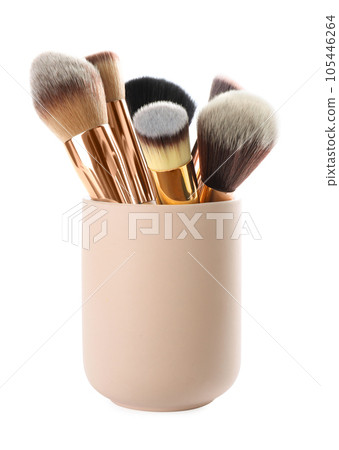 Set of professional makeup brushes in holder isolated on white 105446264
