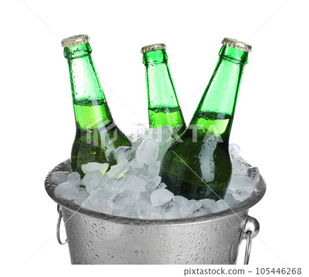 Beer in metal bucket with ice isolated on white Beer in metal bucket with ice isolated on white 105446268