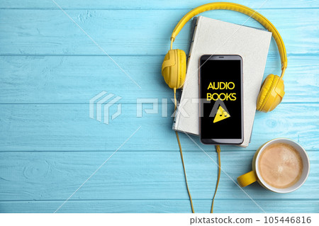 Books, coffee and mobile phone on blue wooden table, flat lay. Space for text 105446816