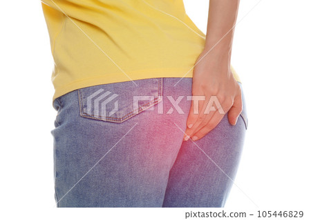 Woman suffering from hemorrhoid on white background, closeup 105446829