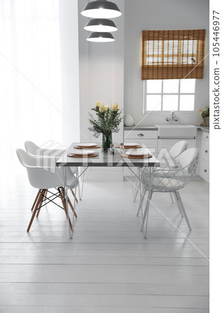 Beautiful dining room interior with new stylish furniture Beautiful dining room interior with new stylish furniture 105446977