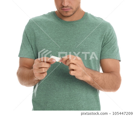 Man with sticking plaster on white background, closeup Man with sticking plaster on white background, closeup 105447209