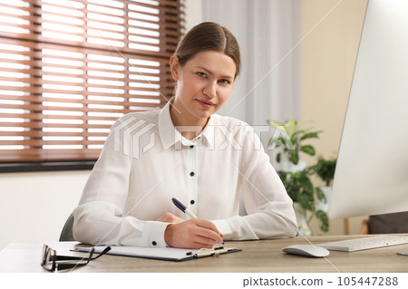 Professional psychotherapist at table in modern office Professional psychotherapist at table in modern office 105447288