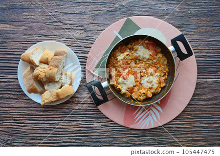 Turkish Menemen omelet in a frying pan. . Turkish Menemen omelet in a frying pan. . 105447475