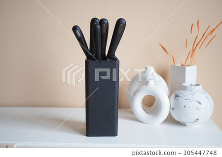 Set of kitchen knives in a box . 105447748