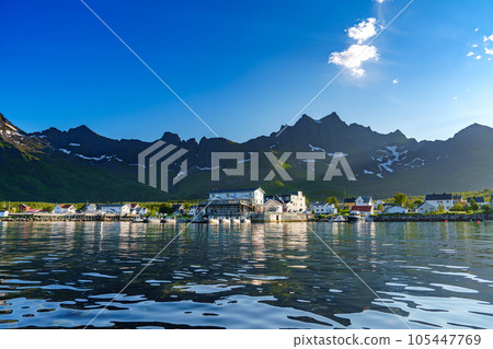 Fishing base in village Mefjordvaer, island Senja, Norway, Mefjord Brygge. Fishing village in summer Fishing base in village Mefjordvaer, island Senja, Norway, Mefjord Brygge. Fishing village in summer 105447769