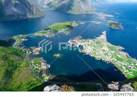 Amazing view from Reinebringen view point. Mountains and blue sea at Lofoten islands. Scenery of Reine fishing village 105447783