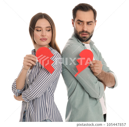 Couple with torn paper heart on white background. Relationship problems 105447857