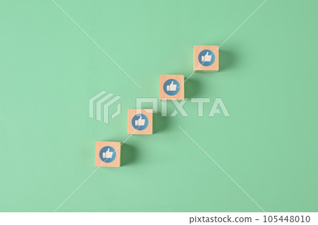 Thumbs up icon on wooden blocks, Happy smile face emotion background, Customer service evaluation, Positive thinking and mental health assessment, Happy client giving feedback with happiness Thumbs up icon on wooden blocks, Happy smile face emotion background, Customer service evaluation, Positive thinking and mental health assessment, Happy client giving feedback with happiness 105448010