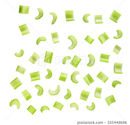 Falling celery slices isolated on white background, clipping path. Falling celery slices isolated on white background, clipping path. 105448686