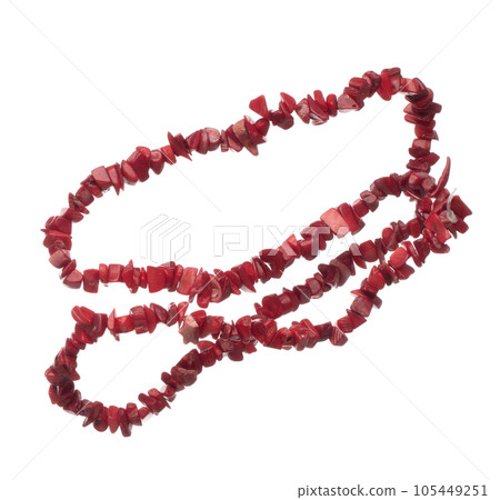 Red stone rock bead style necklet fly in air. Red chilli color bead necklace as gemstone for fashion ornament decorative items. Fashion ornament necklace to add more style. White background isolated Red stone rock bead style necklet fly in air. Red chilli color bead necklace as gemstone for fashion ornament decorative items. Fashion ornament necklace to add more style. White background isolated 105449251