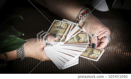 Concept of psychic advisor or ways of divination with cards. Concept of psychic advisor or ways of divination with cards. 105451092