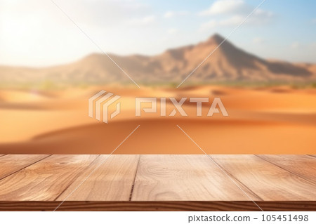 The empty wooden brown table top with blur background of desert dune mountain. Exuberant. The empty wooden brown table top with blur background of desert dune mountain. Exuberant. 105451498