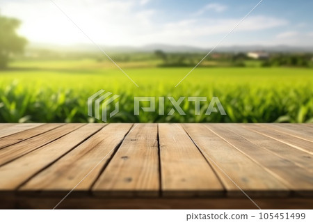 The empty wooden brown table top with blur background of farmland and blue sky. Exuberant. 105451499
