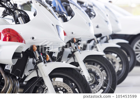 White motorcycles lined up neatly White motorcycles lined up neatly 105453599